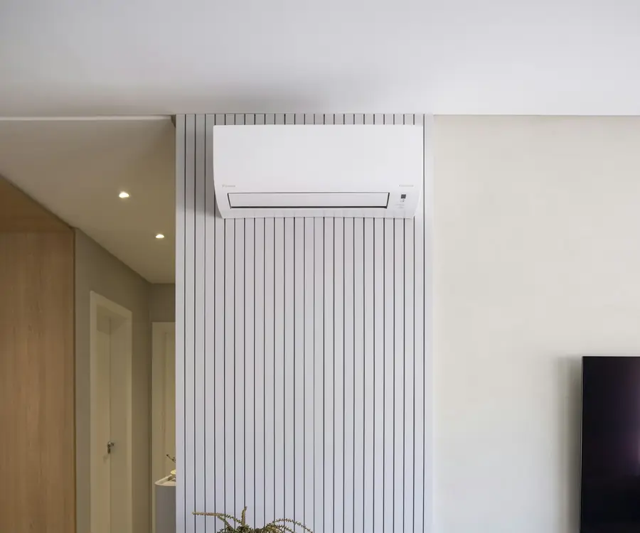 Split system air conditioner in a bright lounge