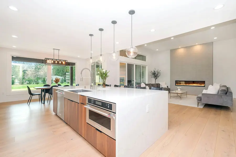 Bright open-plan kitchen with pendant and downlights